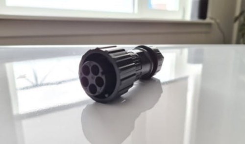 Black oblong plastic two-phase connector