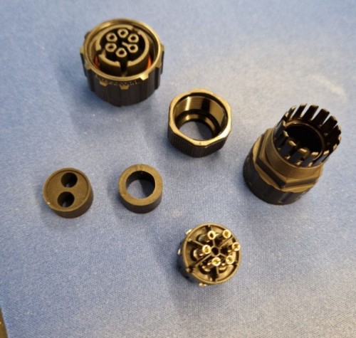 Black six-pin communication connector made of plastic